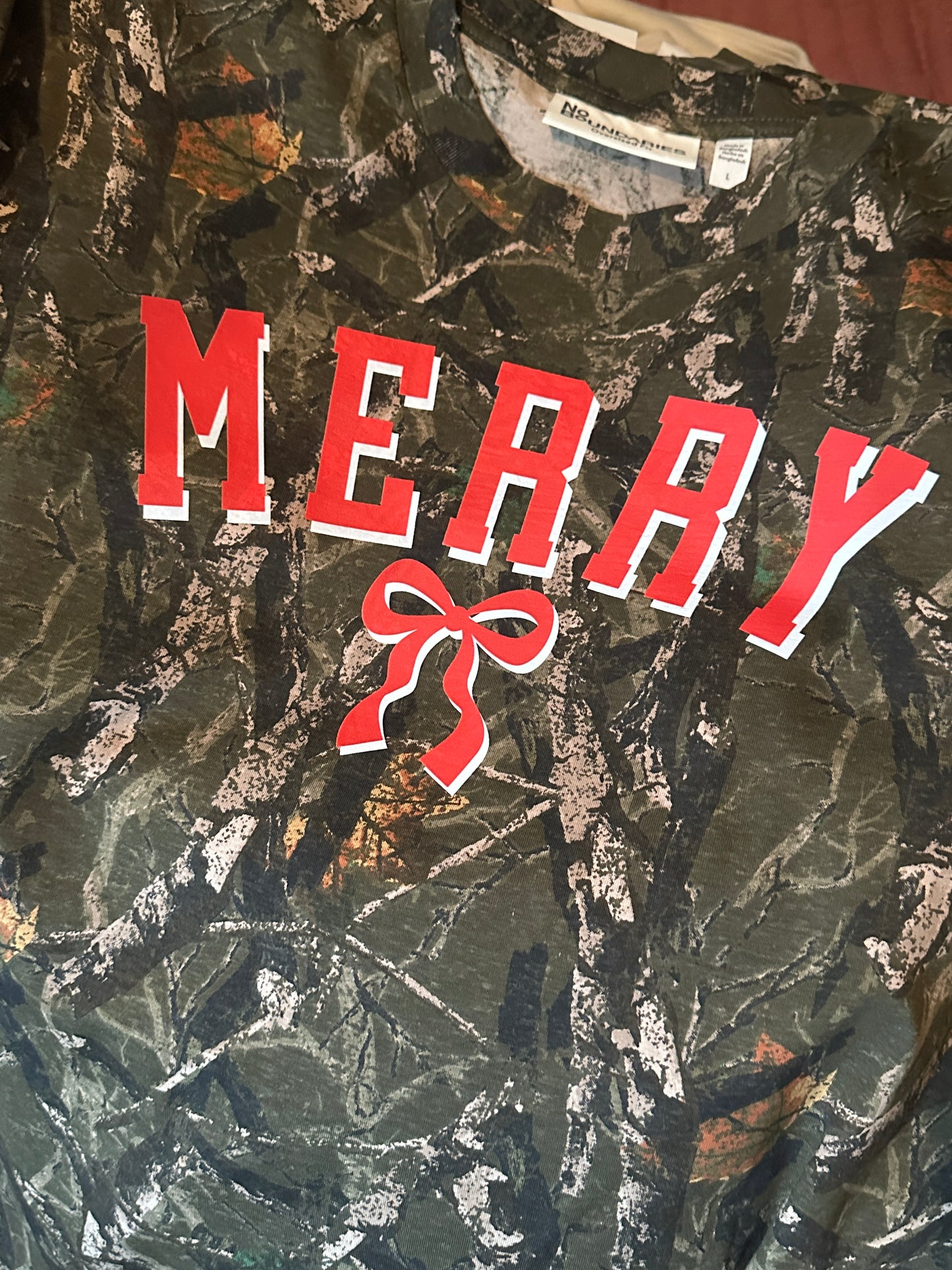 Merry Camo Long Sleeve Christmas Tee, Oversized Fit Holiday Shirt, Festive Red Bow Graphic, Unisex Christmas Outfit, Pre-Order Now, Starts Shipping week of November 10